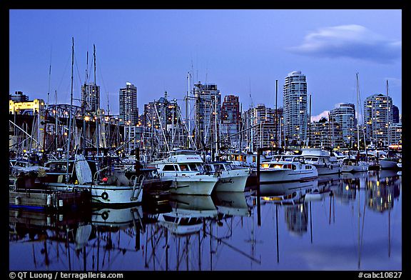 Small boat harbor and skyline at dusk. Vancouver, British Columbia, Canada