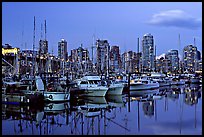 Small boat harbor and skyline at dusk. Vancouver, British Columbia, Canada (color)