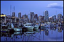 Small boat harbor and skyline at dusk. Vancouver, British Columbia, Canada