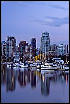 Small boat harbor and skyline at dusk. Vancouver, British Columbia, Canada