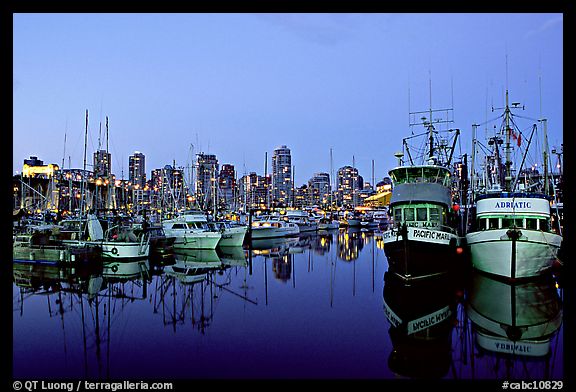 Fishing boats and skyline at dusk. Vancouver, British Columbia, Canada