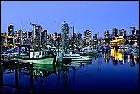 Fishing boats and skyline at night. Vancouver, British Columbia, Canada