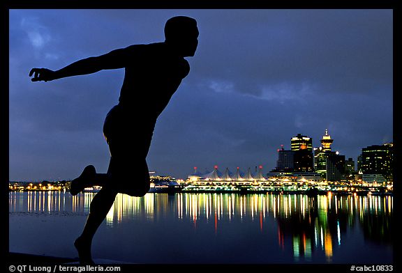 Harry Jerome (a former great sprinter)  statue and Harbor at night. Vancouver, British Columbia, Canada (color)