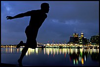 Harry Jerome (a former great sprinter)  statue and Harbor at night. Vancouver, British Columbia, Canada (color)