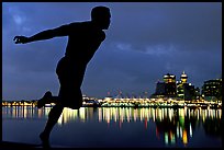 Harry Jerome (a former great sprinter)  statue and Harbor at night. Vancouver, British Columbia, Canada