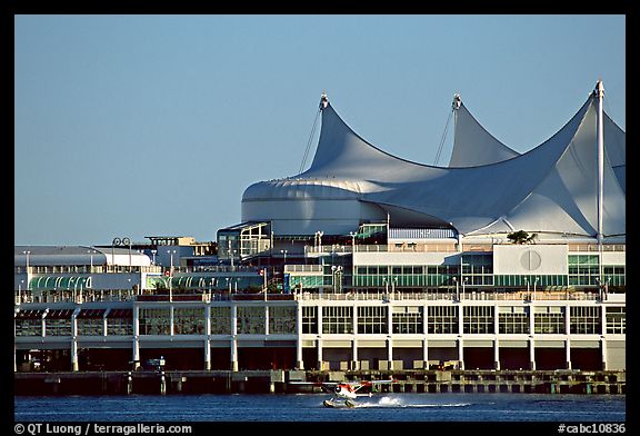 Seaplane taking off in front of Canada Palace. Vancouver, British Columbia, Canada (color)