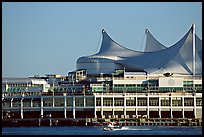 Seaplane taking off in front of Canada Palace. Vancouver, British Columbia, Canada (color)