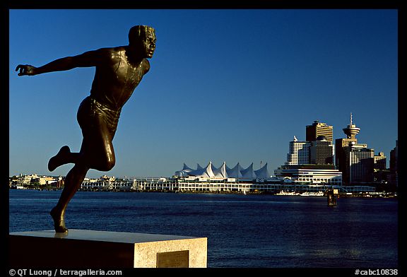 Runner's statue and Harbor center, late afernoon. Vancouver, British Columbia, Canada