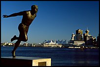 Runner's statue and Harbor center, late afernoon. Vancouver, British Columbia, Canada (color)