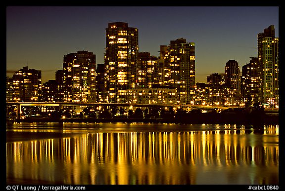 High-rise buildings reflected in False Creek at night. Vancouver, British Columbia, Canada (color)