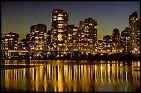 High-rise buildings reflected in False Creek at night. Vancouver, British Columbia, Canada (color)