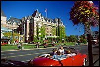 Red convertible car and Empress hotel. Victoria, British Columbia, Canada (color)