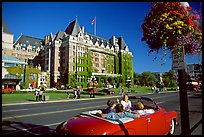 Red convertible car and Empress hotel. Victoria, British Columbia, Canada