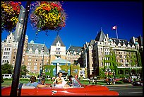 Red convertible car and Empress hotel. Victoria, British Columbia, Canada (color)