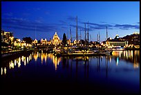 Boats in inner harbour and parliament buildings lights. Victoria, British Columbia, Canada (color)