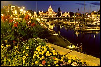 Flowers, inner harbour, and lights at night. Victoria, British Columbia, Canada (color)