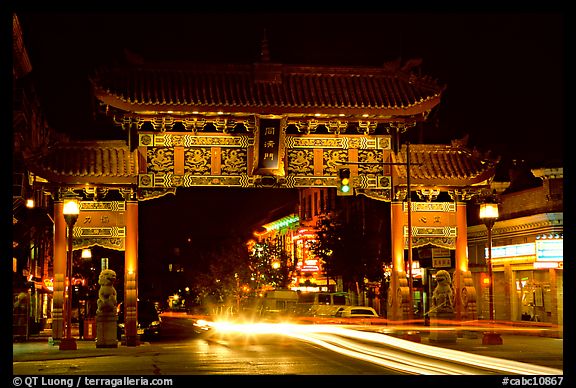 Chinatown gate with trail of lights at night. Victoria, British Columbia, Canada