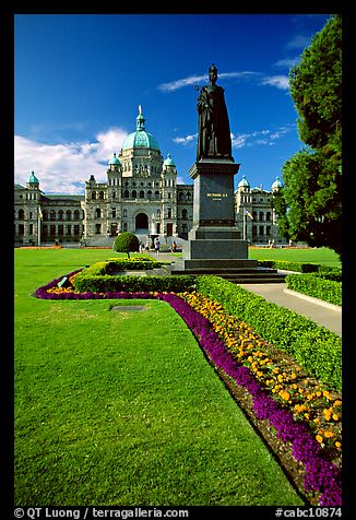 Lawn, statue of Queen Victoria for whom the city was named, and parliament. Victoria, British Columbia, Canada