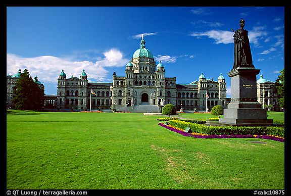 Lawn, statue of Queen Victoria for whom the city was named, and parliament. Victoria, British Columbia, Canada (color)