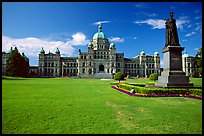 Lawn, statue of Queen Victoria for whom the city was named, and parliament. Victoria, British Columbia, Canada (color)
