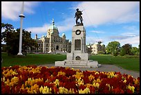 Flowers, memorial, and parliament building. Victoria, British Columbia, Canada (color)