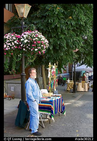 Street art exhibitor, Bastion Square. Victoria, British Columbia, Canada (color)