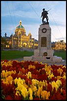 Flowers, memorial, and illuminated parliament. Victoria, British Columbia, Canada (color)