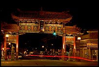 Gate of Harmonious Interest marking the entrance of Chinatown, night. Victoria, British Columbia, Canada (color)