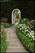 Arched entrance  leading to the Italian Garden. Butchart Gardens, Victoria, British Columbia, Canada (color)
