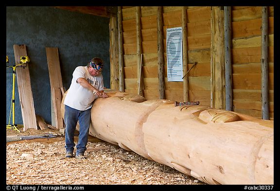 Artist carving a totem pole. Butchart Gardens, Victoria, British Columbia, Canada (color)