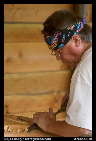 Artist carving a totem pole. Butchart Gardens, Victoria, British Columbia, Canada (color)