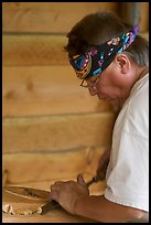 Artist carving a totem pole. Butchart Gardens, Victoria, British Columbia, Canada