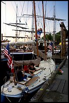 Kids in a small sailboat docked in Inner Habor. Victoria, British Columbia, Canada