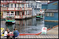 Harbor ferries and outdoor eatery, Upper Harbor. Victoria, British Columbia, Canada (color)