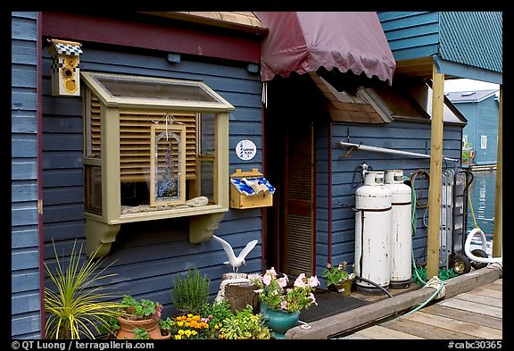 Houseboat window and propane tanks. Victoria, British Columbia, Canada