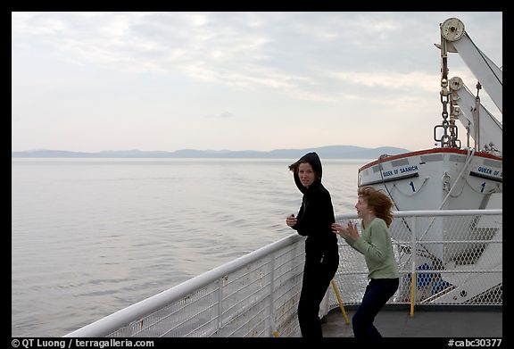 Woman and girl looking out from deck of ferry. Vancouver Island, British Columbia, Canada