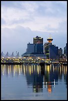 Canada Palace at night and Harbor Center at dawn. Vancouver, British Columbia, Canada (color)