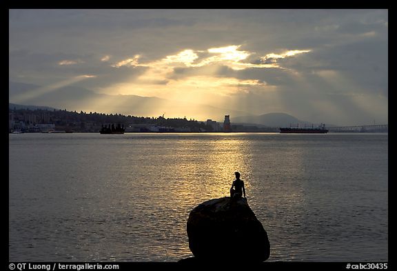 Girl in wetsuit statue, sunrise, Stanley Park. Vancouver, British Columbia, Canada