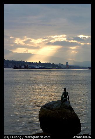 Girl in wetsuit statue, sunrise, Stanley Park. Vancouver, British Columbia, Canada