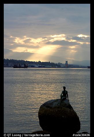 Girl in wetsuit statue, sunrise, Stanley Park. Vancouver, British Columbia, Canada (color)