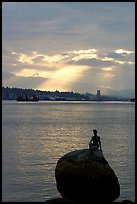 Girl in wetsuit statue, sunrise, Stanley Park. Vancouver, British Columbia, Canada (color)