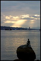 Girl in wetsuit statue, sunrise, Stanley Park. Vancouver, British Columbia, Canada