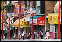 Street in Chinatown with red lamp posts and Chinese characters. Vancouver, British Columbia, Canada