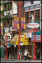 Street in Chinatown with red lamp posts and Chinese script. Vancouver, British Columbia, Canada ( color)