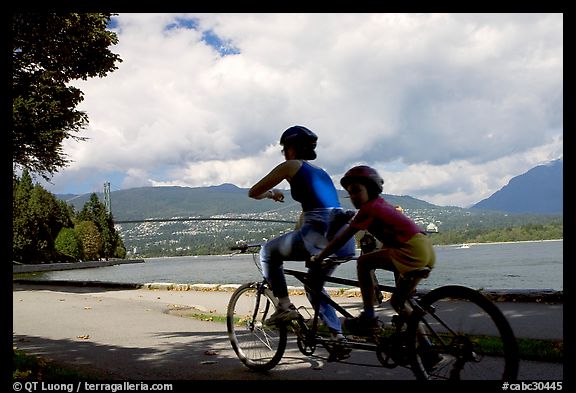 Tandem bicyclist on the trail around Stanley Park. Vancouver, British Columbia, Canada