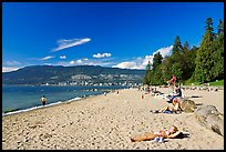 Woman sunning herself on a beach, Stanley Park. Vancouver, British Columbia, Canada