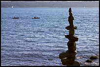 Balanced rocks and kayaks in a distance. Vancouver, British Columbia, Canada