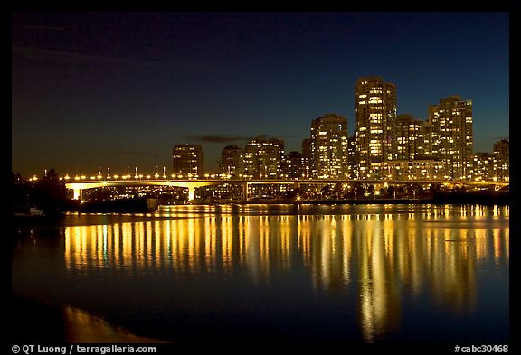 Skyline seen across False Creek at night. Vancouver, British Columbia, Canada (color)