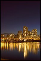 Skyline seen across False Creek at night. Vancouver, British Columbia, Canada