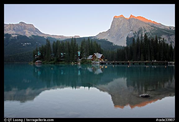 Cabins on the shore of Emerald Lake, with reflected mountains, sunset. Yoho National Park, Canadian Rockies, British Columbia, Canada